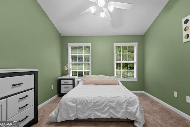 carpeted bedroom featuring vaulted ceiling and ceiling fan