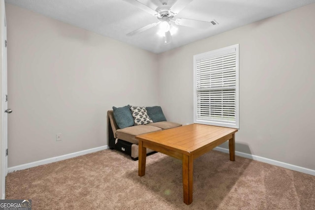 office with light carpet and ceiling fan