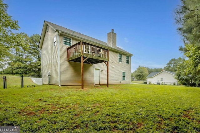 rear view of property featuring a yard