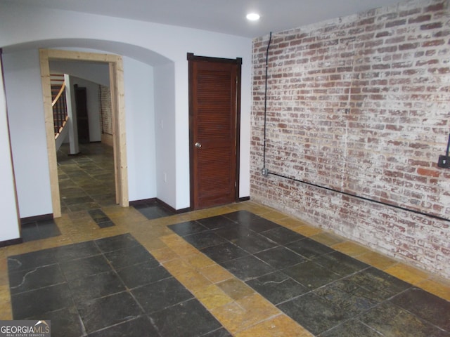140 Walker St SW Unit A, Atlanta, GA 30313 - interior space with stairway, arched walkways, baseboards, brick wall, and recessed lighting