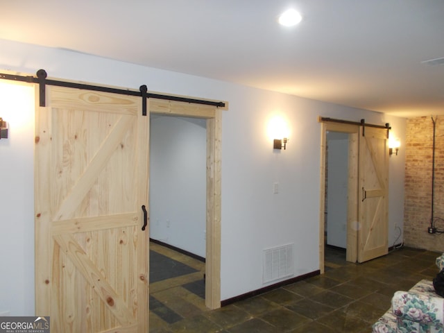 140 Walker St SW Unit A, Atlanta, GA 30313 - living area with a barn door and baseboards
