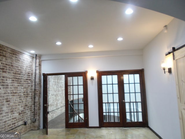140 Walker St SW Unit A, Atlanta, GA 30313 - doorway featuring a barn door, recessed lighting, french doors, baseboards, and brick wall