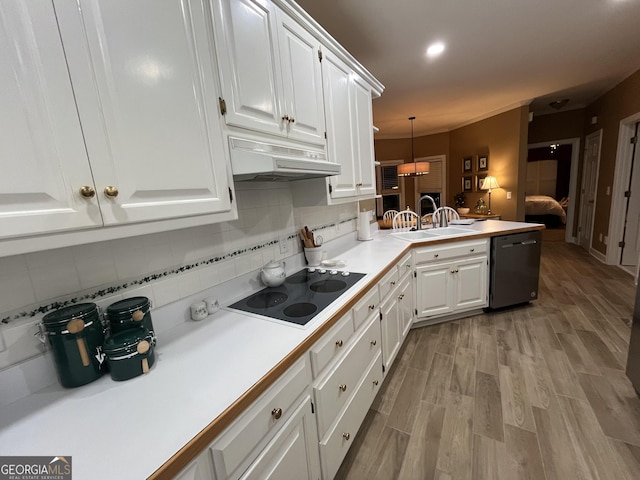 202 Maplewood Cir, Griffin, GA 30224 - kitchen featuring dishwasher, black electric cooktop, a sink, under cabinet range hood, and a peninsula