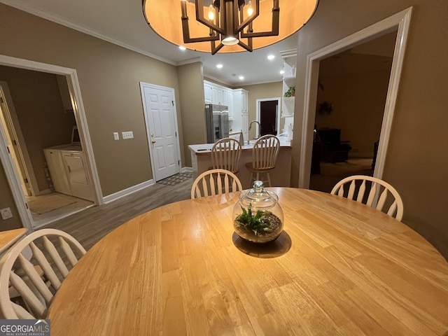 202 Maplewood Cir, Griffin, GA 30224 - dining room with washer and dryer, baseboards, ornamental molding, dark wood finished floors, and recessed lighting