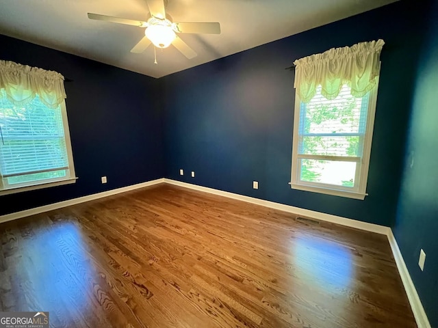202 Maplewood Cir, Griffin, GA 30224 - unfurnished room featuring wood finished floors, ceiling fan, and baseboards