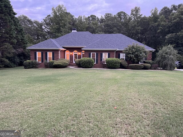 202 Maplewood Cir, Griffin, GA 30224 - single story home with a front yard, brick siding, and a chimney