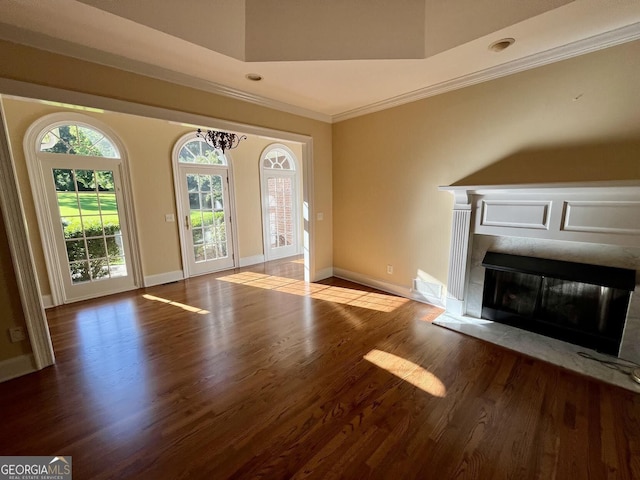 202 Maplewood Cir, Griffin, GA 30224 - unfurnished living room with ornamental molding, wood finished floors, a glass covered fireplace, and baseboards