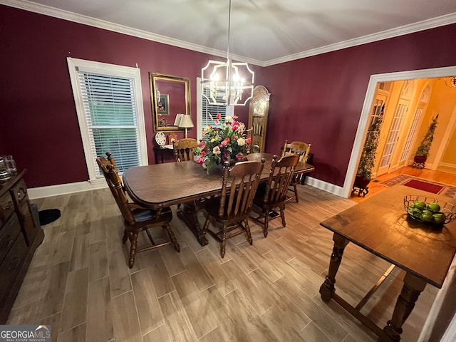 dining room featuring a notable chandelier, hardwood / wood-style flooring, and crown molding