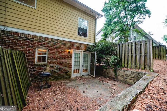 view of side of property featuring a patio