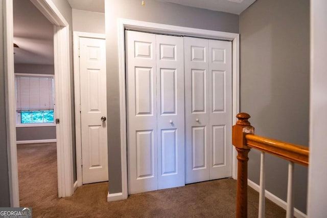 unfurnished bedroom with a closet and carpet