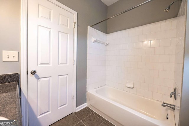 bathroom with tile patterned flooring and tiled shower / bath combo