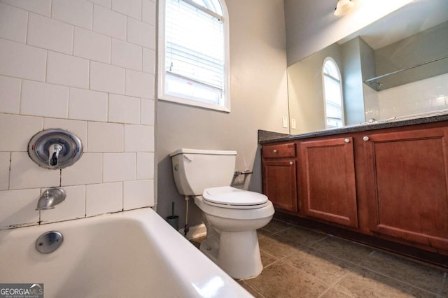 full bathroom featuring vanity, bathing tub / shower combination, toilet, and tile patterned flooring