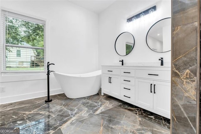 bathroom with vanity and a bathtub