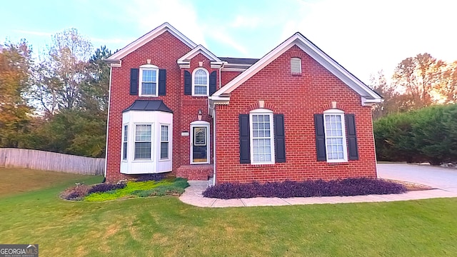 front facade with a front lawn