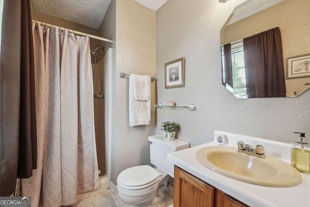 bathroom with vanity, walk in shower, a textured ceiling, tile patterned flooring, and toilet