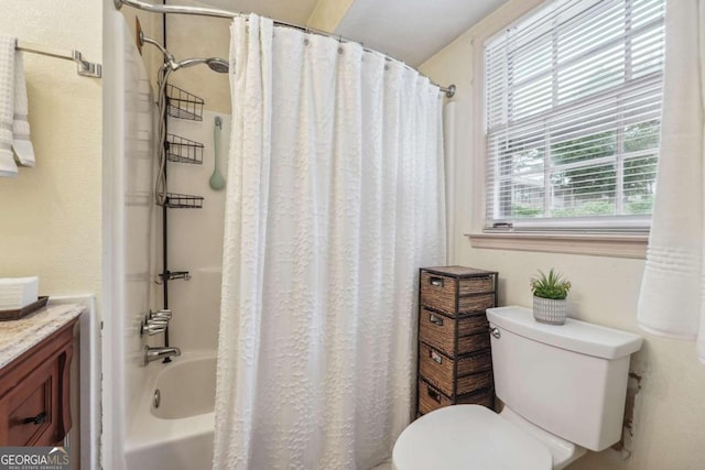 full bathroom featuring shower / bath combination with curtain, vanity, and toilet