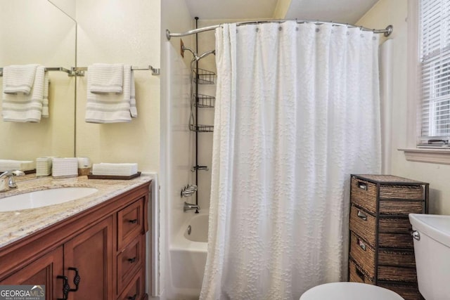 full bathroom with shower / tub combo, vanity, and toilet