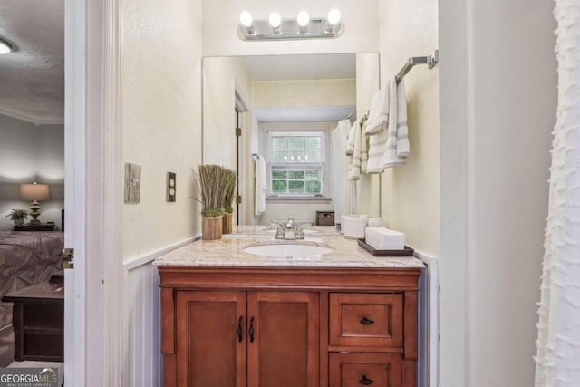 bathroom featuring vanity and a textured ceiling