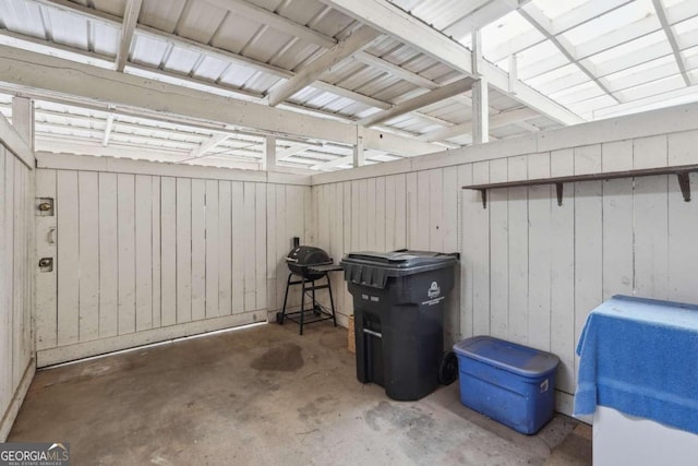 garage featuring wood walls