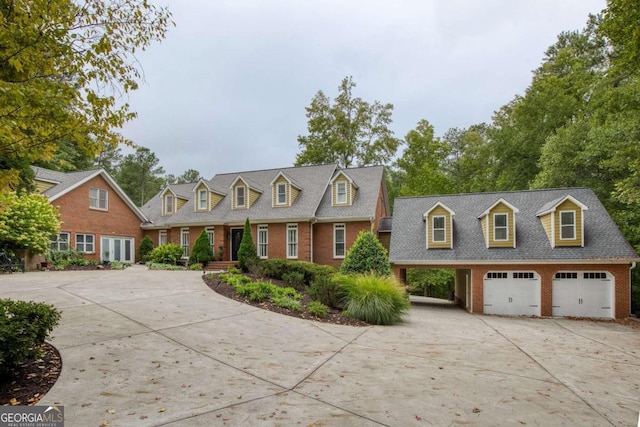 cape cod house with a garage