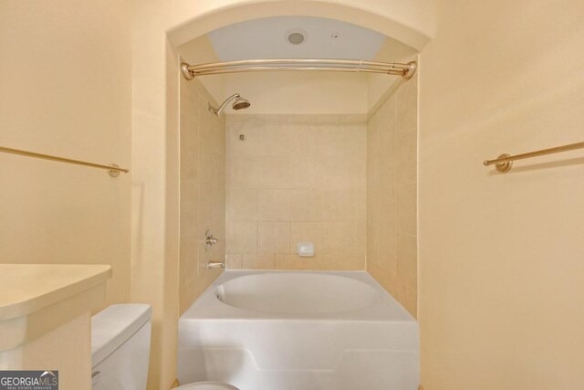 full bathroom with vanity, tiled shower / bath combo, toilet, and tile patterned floors