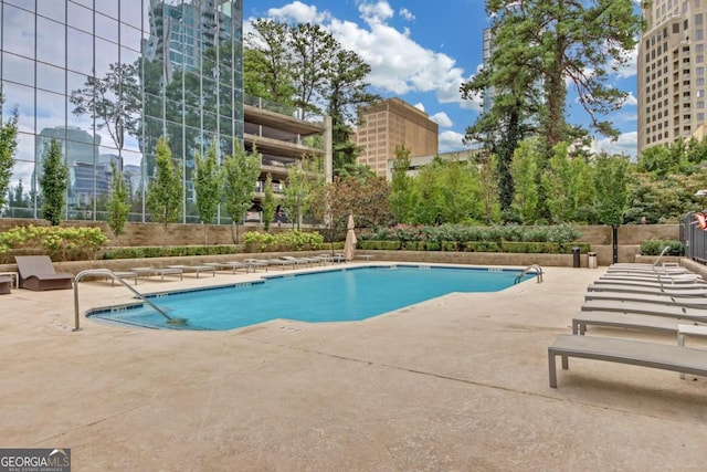 view of swimming pool with a patio area