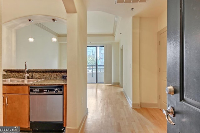 kitchen with dishwasher, light hardwood / wood-style flooring, sink, crown molding, and pendant lighting