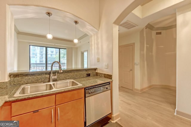 kitchen featuring sink, dishwasher, light wood-type flooring, pendant lighting, and crown molding