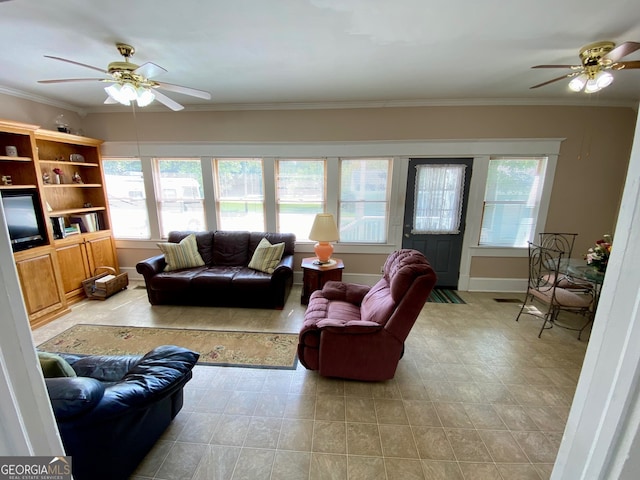 living room featuring ceiling fan and crown molding