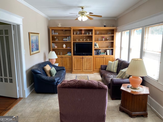 living room with ceiling fan and crown molding