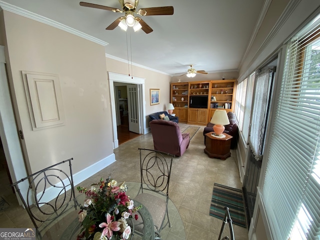 interior space featuring ceiling fan and ornamental molding