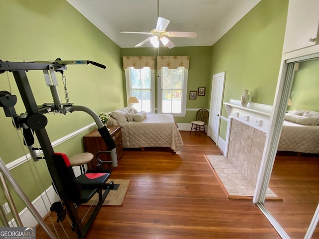 bedroom featuring dark hardwood / wood-style floors and ceiling fan