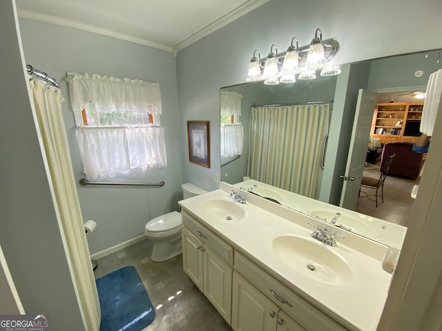 bathroom featuring ornamental molding, vanity, and toilet