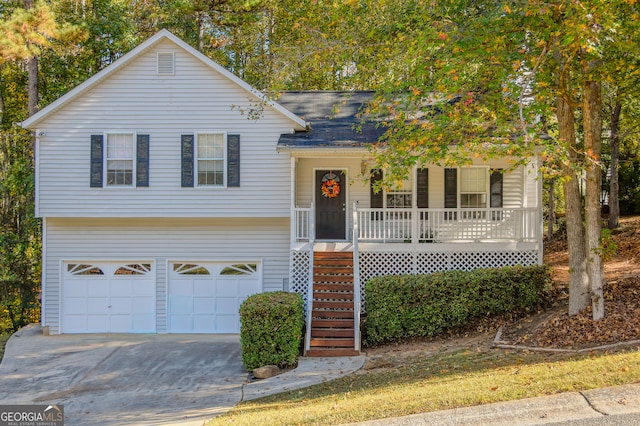 view of front of property with a garage and covered porch