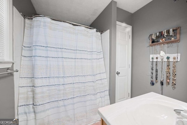 bathroom with a textured ceiling