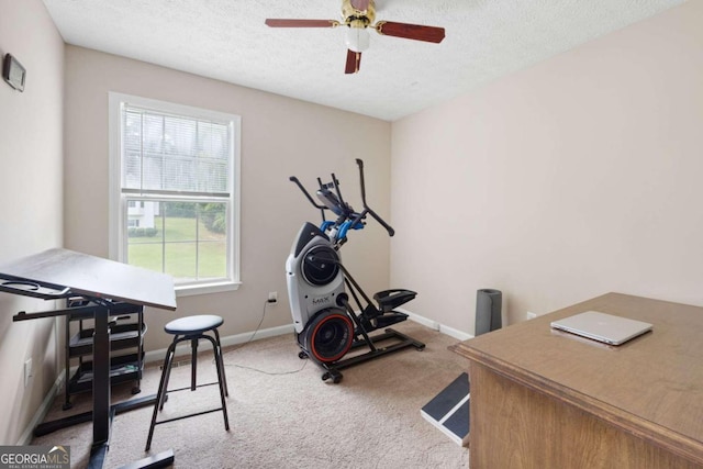 workout area with carpet floors, a textured ceiling, and ceiling fan