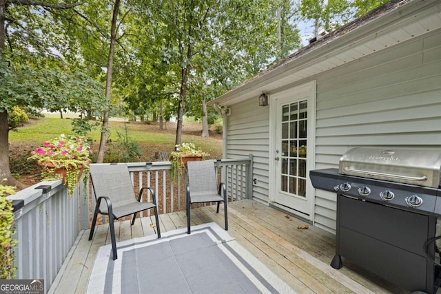 wooden terrace with grilling area