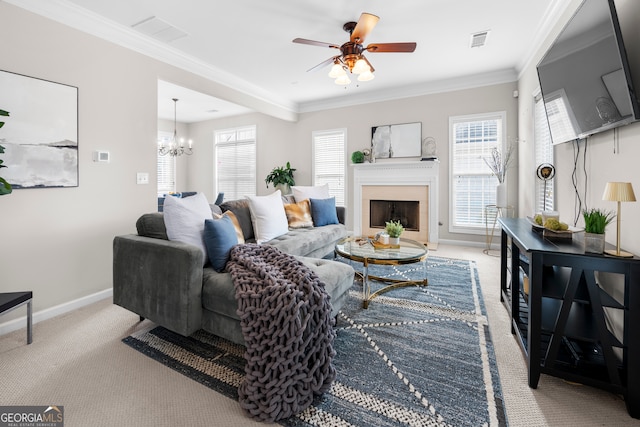 living room featuring crown molding, light carpet, and ceiling fan with notable chandelier