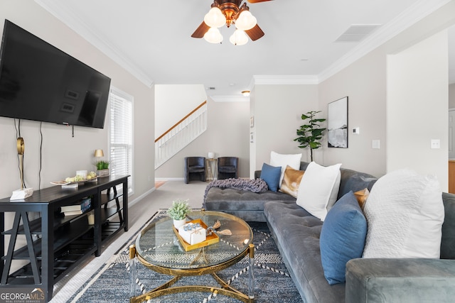 living room with crown molding, carpet, and ceiling fan