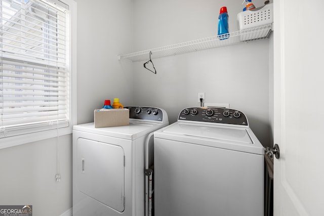 laundry room with washing machine and clothes dryer