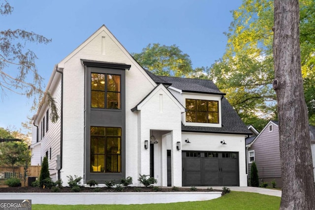 modern farmhouse with a garage and central AC