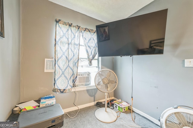 sitting room with carpet floors, cooling unit, and lofted ceiling