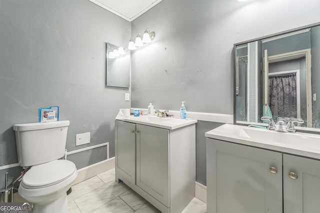 bathroom with vanity, toilet, and curtained shower