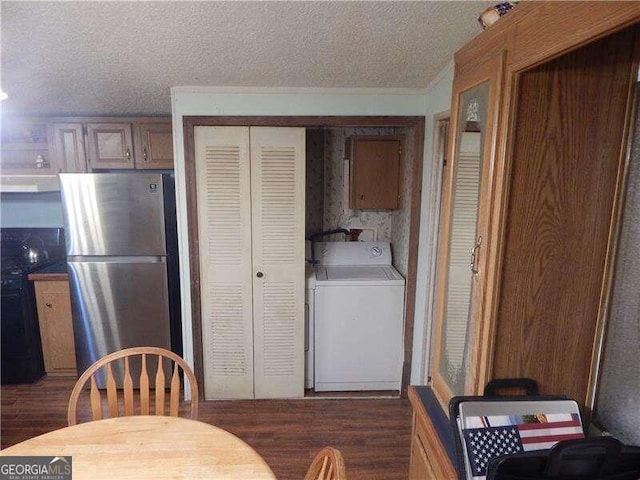 kitchen featuring stainless steel fridge, a textured ceiling, ventilation hood, washer / dryer, and dark hardwood / wood-style floors