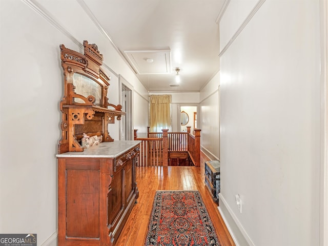 interior space featuring light hardwood / wood-style floors and ornamental molding