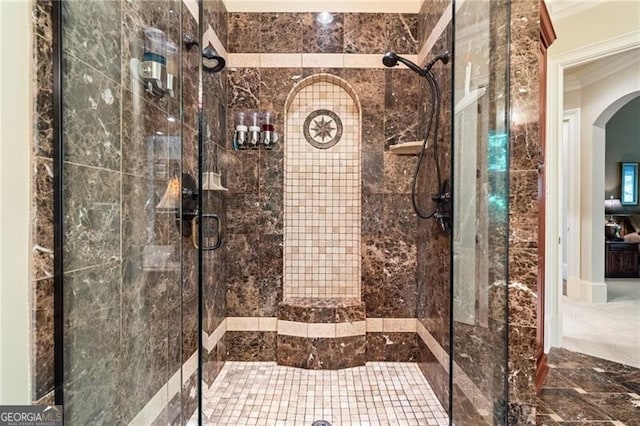 bathroom featuring a shower with shower door