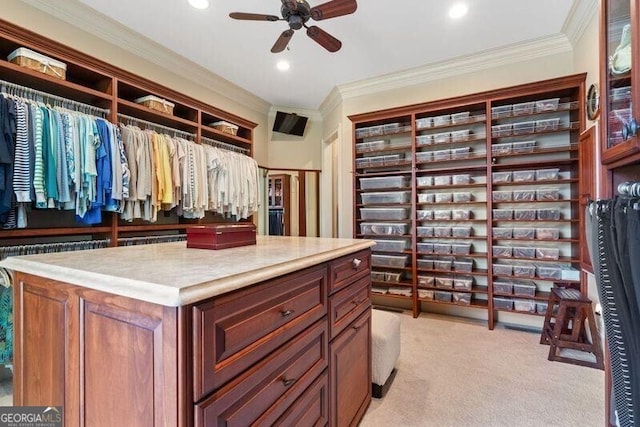 walk in closet featuring light carpet and ceiling fan