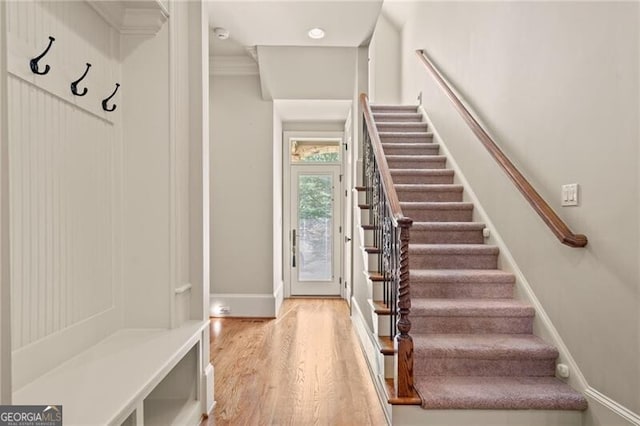 mudroom with light hardwood / wood-style floors