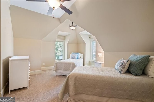 carpeted bedroom with lofted ceiling and ceiling fan