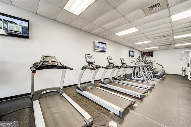 gym featuring a paneled ceiling